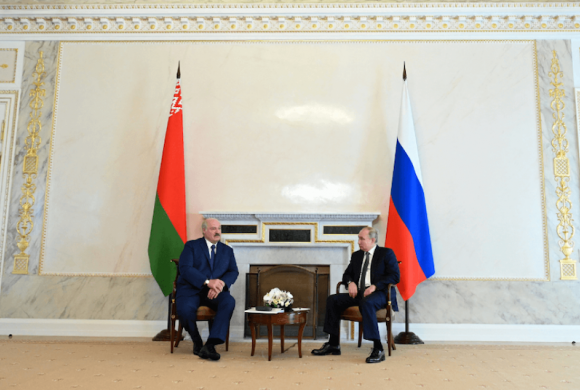 Source: Russian President Vladimir Putin and Belarusian President Alexander Lukashenko talk during a meeting in Saint Petersburg, Russia July 13, 2021. © Reuters